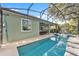 Inviting screened-in pool area perfect for relaxation and outdoor entertainment with tiled pool and patio area at 929 Magnolia Blossom Ct, Apopka, FL 32712