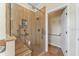 A beautifully tiled shower with a built-in seat and grab bars for accessibility and convenience at 929 Magnolia Blossom Ct, Apopka, FL 32712