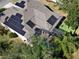 House with solar panels, pool, and backyard at 1148 Calloway Cir, Clermont, FL 34711