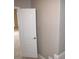 Open bedroom door, showing carpeted floor and neutral walls at 1148 Calloway Cir, Clermont, FL 34711