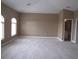 Spacious carpeted bedroom with large arched windows at 1148 Calloway Cir, Clermont, FL 34711