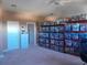 Large bonus room with ample storage shelving at 1148 Calloway Cir, Clermont, FL 34711