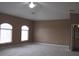 Main bedroom with arched windows and ceiling fan at 1148 Calloway Cir, Clermont, FL 34711