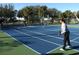 Active pickleball game in progress on a well-maintained court at 1148 Calloway Cir, Clermont, FL 34711