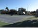 Two tennis courts with players enjoying a sunny day at 1148 Calloway Cir, Clermont, FL 34711