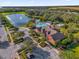 Aerial shot of neighborhood clubhouse featuring a lake and community pool at 1961 Nations Way, Saint Cloud, FL 34769