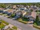 Aerial view of neighborhood features well-maintained landscaping and sidewalks at 1961 Nations Way, Saint Cloud, FL 34769