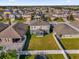 An aerial view looking down at a beautiful home with a lush green backyard and white fence at 1961 Nations Way, Saint Cloud, FL 34769