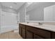 Bathroom showcasing a double sink vanity, tile floor and tub with shower at 1961 Nations Way, Saint Cloud, FL 34769