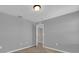 Bedroom featuring neutral walls, carpeted floors, and a doorway to another room at 1961 Nations Way, Saint Cloud, FL 34769