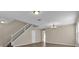 Foyer area showcasing the staircase, hardwood floors, and neutral paint scheme at 1961 Nations Way, Saint Cloud, FL 34769