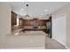 Kitchen featuring granite countertops, stainless steel appliances, and dark wood cabinetry at 1961 Nations Way, Saint Cloud, FL 34769