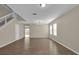 Living room featuring laminate floors, view of backyard through sliding glass door and neutral walls at 1961 Nations Way, Saint Cloud, FL 34769