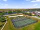 Aerial view of community sports park, including tennis and basketball courts plus a volleyball sand pit at 1961 Nations Way, Saint Cloud, FL 34769