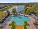 Stunning community pool with a fountain-filled lake backdrop, perfect for relaxation and recreation at 1961 Nations Way, Saint Cloud, FL 34769