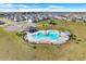 An inviting community pool with a surrounding patio and lounge chairs at 2011 Chickasaw Blvd, Davenport, FL 33837