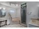 Bathroom featuring vanity, tiled shower with glass door and bathtub at 33516 Overton Dr, Leesburg, FL 34788