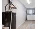 Bright laundry room with washer, dryer, and shelving at 33516 Overton Dr, Leesburg, FL 34788