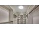 Walk-in closet with custom shelving and ample space for organizing clothes and accessories at 33516 Overton Dr, Leesburg, FL 34788