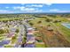 Aerial view of house and surrounding community at 34045 Alameda Dr, Sorrento, FL 32776