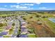 Wide aerial view of a neighborhood with houses and green spaces at 34045 Alameda Dr, Sorrento, FL 32776