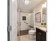 Bathroom with a glass enclosed shower featuring built in bench and safety bar at 2552 English Ivy Cir, The Villages, FL 32162