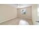 Bright bedroom featuring sleek, light-colored floors and a ceiling fan at 2552 English Ivy Cir, The Villages, FL 32162