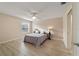 Bedroom with a fan, a window and wood-look flooring at 2552 English Ivy Cir, The Villages, FL 32162