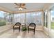 Sunroom with wicker chairs and plenty of natural light at 2552 English Ivy Cir, The Villages, FL 32162