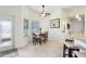 Bright breakfast nook with wood table and chairs, ceiling fan and light colored floors at 36729 Alaqua Ct, Eustis, FL 32736