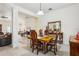 Formal dining room with wood table, decorative chairs, and elegant decor at 36729 Alaqua Ct, Eustis, FL 32736