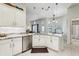 Bright kitchen featuring stylish pendant lighting, island seating, and stainless steel appliances at 36729 Alaqua Ct, Eustis, FL 32736