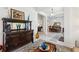 Open-concept living room with wood console table, view to formal dining and Gathering room at 36729 Alaqua Ct, Eustis, FL 32736