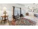 Cozy seating area with decorative rug, natural light, and view of the breakfast nook at 36729 Alaqua Ct, Eustis, FL 32736