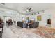 Open living area with dining room, living room, and view to the Gathering room at 36729 Alaqua Ct, Eustis, FL 32736