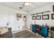 Bright office featuring a work area with storage, a sofa, and unique decor at 36729 Alaqua Ct, Eustis, FL 32736