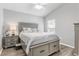 Bedroom with gray furniture and wood floors at 5569 Bougainvillea Ave, The Villages, FL 32163