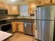 Kitchen with stainless steel appliances and wood cabinets at 718 Villita Ln, Lady Lake, FL 32159