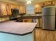 Spacious kitchen featuring stainless steel appliances and an island at 718 Villita Ln, Lady Lake, FL 32159