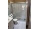 Bathroom with a glass-enclosed shower, white tile, and a white vanity at 12144 Bruceton Way # 101, Orlando, FL 32828