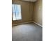 Empty bedroom featuring neutral paint, carpeted flooring, and a window with blinds at 12144 Bruceton Way # 101, Orlando, FL 32828