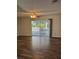 Bright living room with new floors and glass sliding door to a screened lanai at 12144 Bruceton Way # 101, Orlando, FL 32828