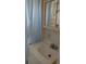 Clean bathroom with a vanity sink, medicine cabinet, and shower at 1432 South Shore Dr, Tavares, FL 32778