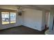 Spacious living room with window and AC unit at 1432 South Shore Dr, Tavares, FL 32778