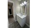 Modern bathroom vanity with white cabinets and quartz countertop at 1566 Lawndale Cir, Winter Park, FL 32792