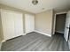 Bright bedroom with double closets and gray vinyl flooring at 1566 Lawndale Cir, Winter Park, FL 32792