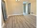 Bright dining room with gray vinyl flooring and chandelier at 1566 Lawndale Cir, Winter Park, FL 32792