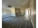 Expansive living room with vaulted ceiling and modern gray wood-look flooring at 1566 Lawndale Cir, Winter Park, FL 32792