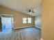 Bright living room with vinyl flooring and a ceiling fan at 1566 Lawndale Cir, Winter Park, FL 32792