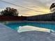 Inviting swimming pool with brick wall backdrop at 1566 Lawndale Cir, Winter Park, FL 32792